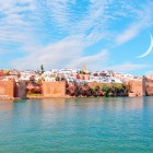 Panoramic view of Rabat with the Atlantic Ocean, the Kasbah of the Udayas, and the historic minarets overlooking the capital of Morocco.