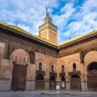The Al-Bouanania Medersa in Fès, with carved arches and refined mosaics, is a gem of 14th-century Islamic art and a center of historical culture.