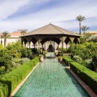 The central gazebo of the Secret Garden in Marrakech, surrounded by plants and fountains, offers a corner of tranquility in the historic garden.