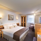 The standard double room at Hotel Estoril 3* in Mexico City offers essential comfort, a cozy bed, free Wi-Fi, and air conditioning in a central location.
