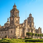 The Metropolitan Cathedral of Mexico City, overlooking the Zócalo, enchants with its Baroque and Neoclassical façade, imposing towers, and unique historic details.