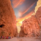 The Todra Valley canyon, among rocky mountains and palm groves, offers spectacular gorges, traditional villages, and breathtaking natural landscapes.