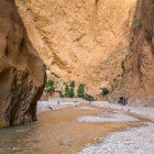 The Todra Valley is crossed by the Todra River, which flows through spectacular gorges, palm groves, and traditional villages among the High Atlas Mountains.
