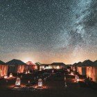 In Merzouga, staying in a tented camp under the stars offers desert nights among silent dunes, starry skies, and breathtaking landscapes.