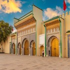 The Royal Palace of Fez, with its golden gates and refined mosaics, is a symbol of the majesty and traditional Moroccan art dating back to the 9th century.