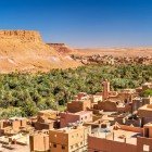 Tinghir, an oasis among the Atlas Mountains, offers breathtaking views of centuries-old palm groves and mud-brick kasbahs, symbols of Berber architecture.