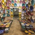 The colorful plates of Tamgroute, made with copper glazes in ancient Berber kilns, represent a unique artisanal tradition of southern Morocco.