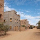 Tamgroute is an ancient village in southern Morocco, known for its green ceramics, adobe houses, and the historic zawiya that preserves valuable manuscripts.