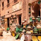 Next to the Tamgroute workshop, there are shops selling artisanal ceramics, including vases, plates, and items with the characteristic green glaze of the area.