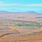 From above, the Ounila Valley reveals a landscape of hills and valleys, with Berber villages and red-earth kasbahs blending harmoniously with the surrounding nature.