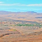 From above, the Ounila Valley reveals a landscape of hills and valleys, with Berber villages and red-earth kasbahs blending harmoniously with the surrounding nature.
