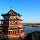 The Pavilion of the Fragrance of the Buddha in the Summer Palace, set among hills and lakes, blends architectural elegance and spirituality with golden roofs and carved details.
