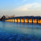 The Seventeen-Arch Bridge in the Summer Palace, a majestic structure over Kunming Lake, connects Longevity Island with elegance and traditional sculptural details.
