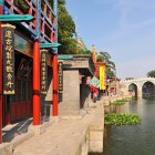 The Three-Arch Bridge is located in Suzhou, Jiangsu Province, China, famous for its canals, classical gardens, and traditional architecture.