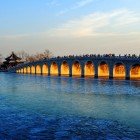 The Seventeen-Arch Bridge in the Summer Palace connects Nanhu Island, featuring elegant stone arches and artistic details of Chinese tradition.