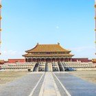 The main entrance of the Forbidden City, with its red gates and golden details, welcomes visitors on a journey into the heart of ancient imperial China.