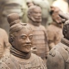 Two terracotta soldiers, unique in their realism, display minute details of armor and expressive faces, a testament to ancient Chinese art.