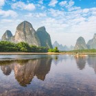 The clear waters of the Li River flow among Guilin’s karst mountains, reflecting the spectacular scenery of southern China.