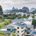 Fubo Hill rises against the backdrop of the town of Guilin, between the Li River and the characteristic karst mountains of southern China.