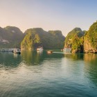 Among the cliffs of Ha Long Bay, Sung Sot Cave enchants with towering stalactites, golden reflections, and natural chambers sculpted by time.