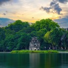 In the center of Hoan Kiem Lake stands the Turtle Tower, an ancient symbol of Hanoi linked to the legend of the sacred sword and the return of peace.