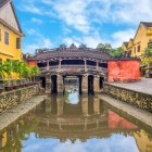 In Hoi An, the Japanese Covered Bridge rises among alleys and canals, a symbol of history, culture, and Chinese architectural influences in the ancient town.