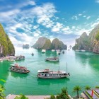 A stunning view of Halong Bay shows emerald green waters and thousands of karst islets dotting the horizon.