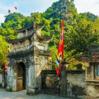 The Temple of the Dinh and Le Kings in Hoa Lư celebrates the first rulers of Vietnam, among historic buildings nestled in the hills with traditional architecture.
