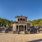 In Hué, King Khai Dinh’s Tomb reflects the life of the Nguyen monarch with detailed mosaics, imposing statues, and unique 20th-century decorations.