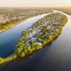 Aerial view of Con Hen and the Perfume River in Hué, among calm waters, historic bridges, and picturesque scenes of the Vietnamese imperial city.