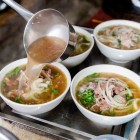 Vietnamese soup with meat and fresh vegetables, rich in local flavors and spices, a simple yet representative dish of traditional cuisine.