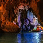 The cave in Tam Cốc National Park winds between karst mountains and calm rivers, providing a scenic natural setting typical of Vietnam.