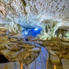 Sửng Sốt Cave in Halong Bay, one of the largest and most spectacular, amazes with wide halls and breathtaking limestone formations.