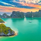 Halong Bay, a UNESCO World Heritage Site, is famous for its emerald green waters and the thousands of karst islets rising through mist and sunlight.