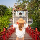 The red bridge of Hoan Kiem Lake, called The Huc, connects the shore to the Ngoc Son Temple and stands as an elegant symbol of Hanoi’s harmony.