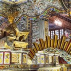 King Khai Dinh’s Tomb in Hué fascinates with ornate interiors, sparkling mosaics, and the bronze statue of the emperor, a symbol of elegance and power.