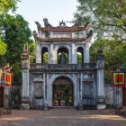 The entrance gate of Van Mieu, Hanoi’s Temple of Literature, preserves ancient inscriptions and architecture that celebrate Confucian culture.