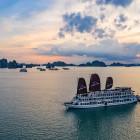 The Victory Star Cruise tour navigates Halong Bay among karst islets, emerald waters, and breathtaking sunsets for an unforgettable experience.