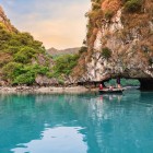 Amid the emerald waters of Ha Long, the sampan glides through hidden caves, sparkling stalactites, and reflections that tell stories of stone.