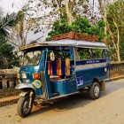 Xe loi tour through the countryside of Ben Tre, among palm groves, canals, and villages, to experience rural life in the Mekong Delta, Vietnam.