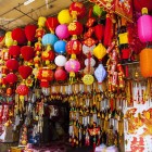 Decorative lanterns and traditional souvenirs sold at the market reflect the creativity and traditions of Vietnamese villages.