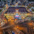 Aerial view of Bến Thành Market in Ho Chi Minh, with modern buildings, transport, and energy infrastructure, showcasing the city’s urban development.