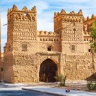 Ancient earthen kasbahs line the road to Zagora, between palm groves and the Atlas Mountains. A journey through Berber history, oases and authentic Moroccan landscapes.