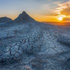 The mud volcanoes of Gobustan create an almost lunar landscape, with grey hills and clay cracks: a unique natural spectacle near Baku, Azerbaijan.