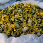 Close-up of Althaea officinalis, or marshmallow herb, in a white bag at the lively Yashil Bazar in Baku, among dried herbs, spices, and authentic local traditions.