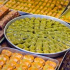 Traditional Azerbaijani sweets displayed at Baku market, including baklava and local specialties, rich in colors, aromas, and authentic flavors.