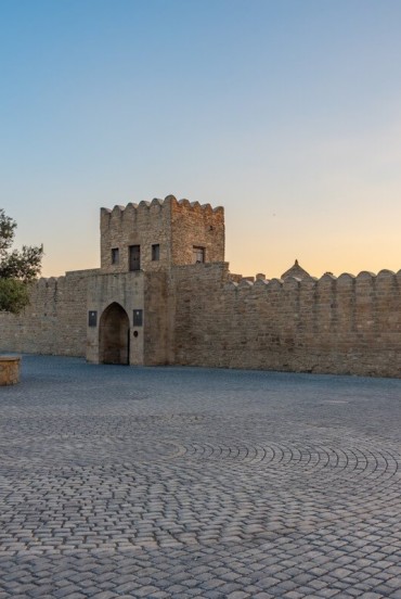 The Fire Temple on the Absheron Peninsula in Azerbaijan is an ancient stone complex symbolizing fire worship, set in a historic and evocative atmosphere