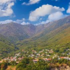 The hillside village of Kish, in the Azerbaijani Caucasus, charms with red-roofed houses set in greenery and an authentic, scenic natural landscape.