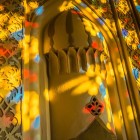 Light filters through the glass mosaics of the windows and reflects on the walls of the Khan’s Palace, creating evocative plays of color.