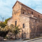 Anchiskhati Basilica features a three-aisled structure in stone and brick, with sober lines and narrow windows, typical of early Georgian Christian architecture.